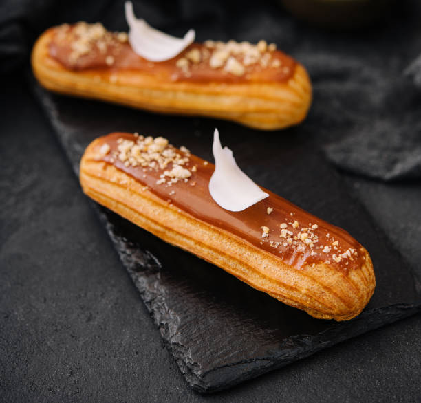 istock Traditional french dessert. eclair with caramel 1470943764