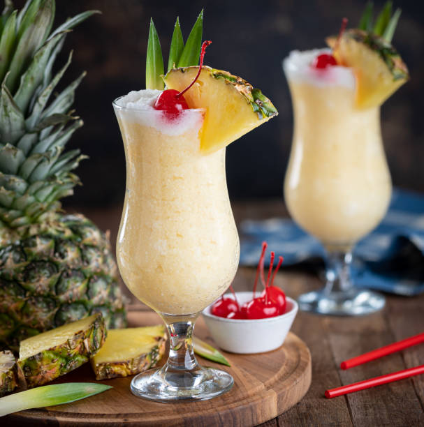 istock Pina colada cocktail with cherry, pineapple and leaves 1470944934