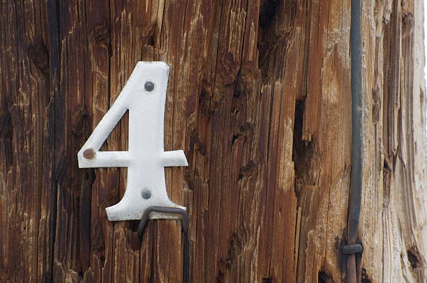 istock Metal Number Four on Wood Background 147094812