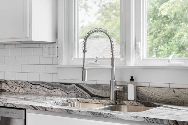 istock A kitchen sink detail in a white kitchen with subway tiles. 1470948126