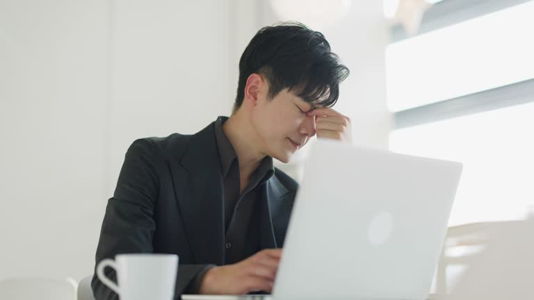 Young business men tired of work