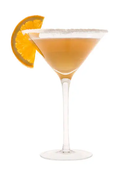 Sidecar mixed drink with orange slice garnish on white background