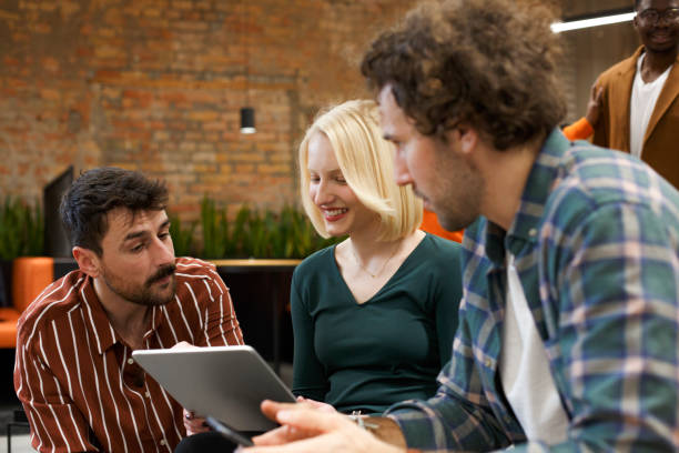 istock Young colleagues are sitting in a shared office space in the start-up company. 1470950996
