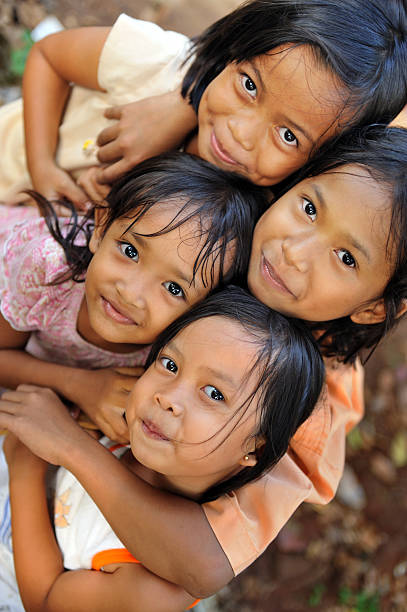 Poverty Children Group of happy poverty kids indonesian ethnicity stock pictures, royalty-free photos & images