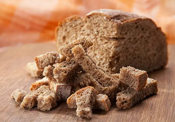 Black bread dried crust closeup