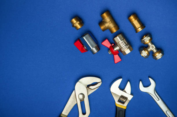 istock A set of tools for plumbing isolated on a blue background 1470953020