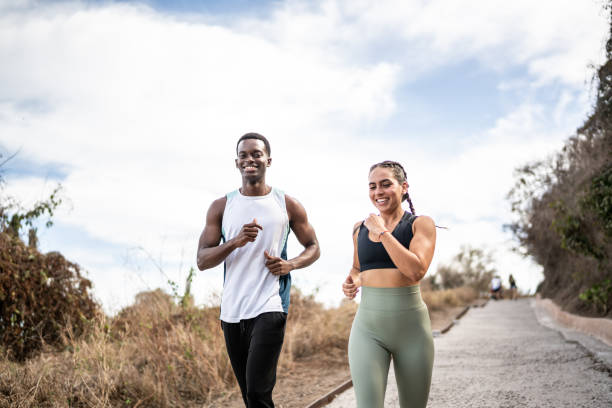 istock Friends running together outdoors 1470956146