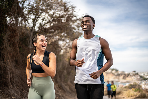 istock Friends talking while running outdoors 1470956177