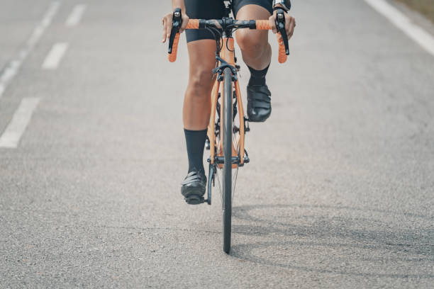 istock low angle view asian chinese cyclist on road with shadow 1470956233