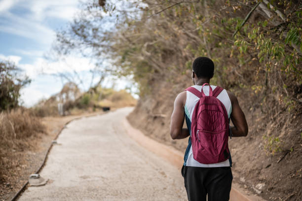 istock Young man hiking outdoors 1470956279