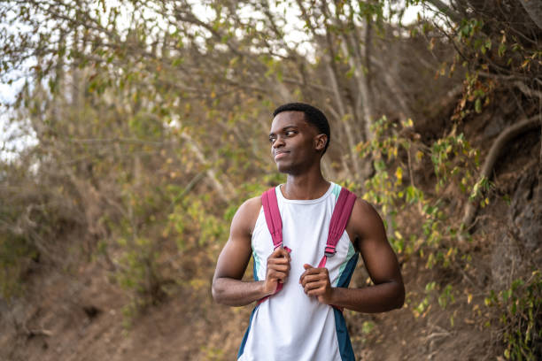 istock Young man looking around during hike outdoors 1470956294