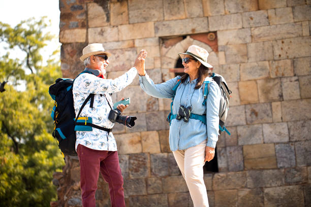 istock Senior couple exploring historic architecture and giving hi-five 1470956367