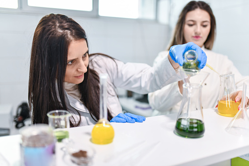 Expertise Shown By Female Chemist In Laboratory