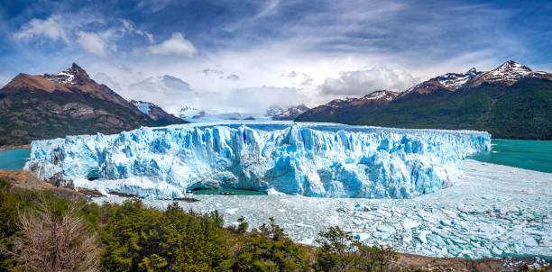 istock a large glacier is in the foreground and mountains behind it 1470956544