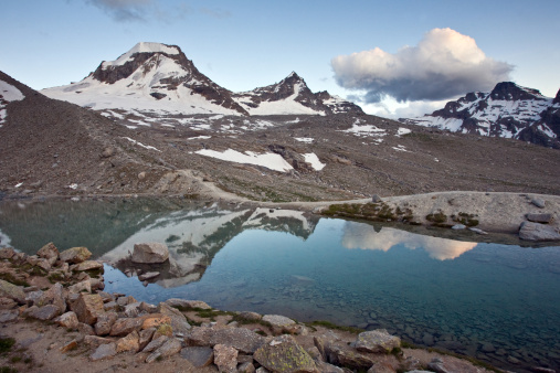 Glacier lake, with reflection of mountain peaks. Italian Alps, Gran Paradiso National Park