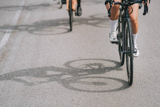 istock low section focus on shadow cyclist team cycling in morning 1470956888