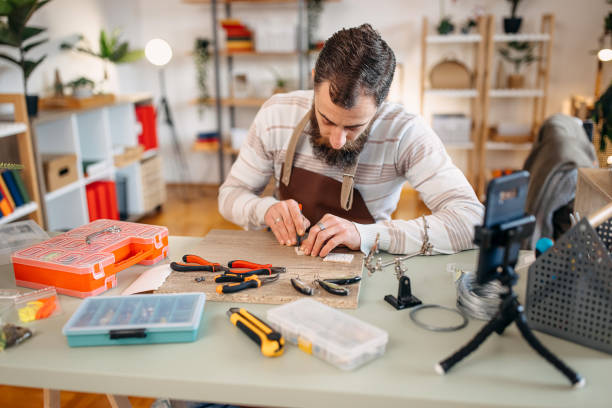 istock Man makes fishing lures 1470957240