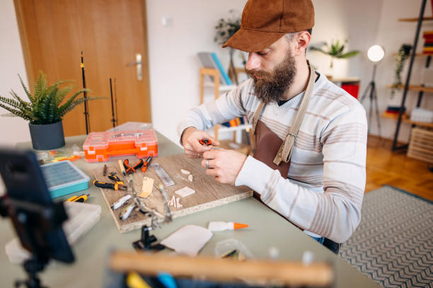 istock Man makes fishing lures 1470957758