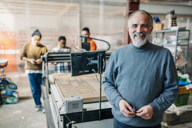 istock Smiling senior professor looking at camera 1470958731