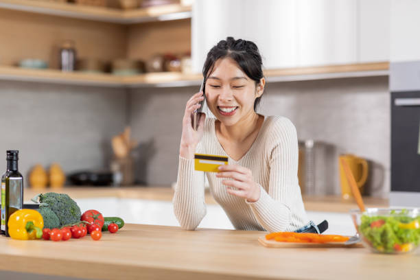 istock Pretty korean lady making order, talking on smartphone 1470958803