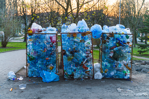 Dirty street with overfilled containers for plastic in Kaliningrad, Russia.