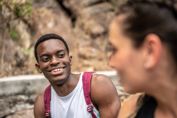 istock Young man talking with his friend outdoors 1470959497