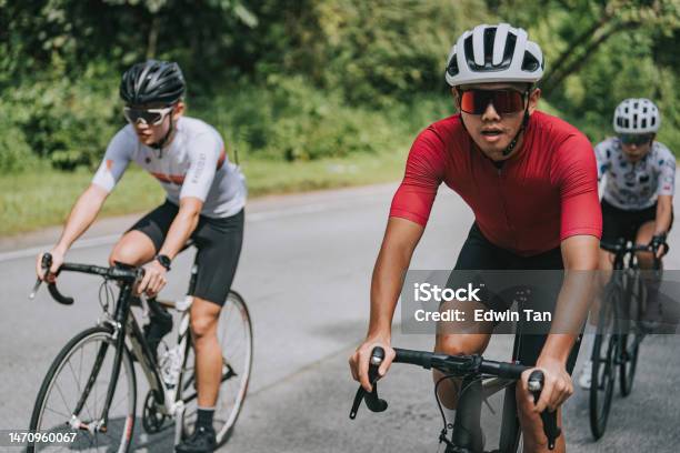 Asian Chinese Cyclist In Rural Scene Cycling Event Stock Photo - Download Image Now - Cycling, Sports Race, Sunglasses