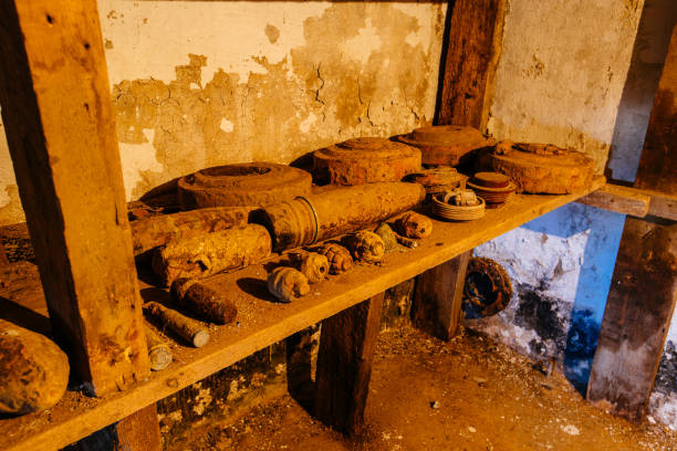 Old rusty ammo, tank shells, mines and grenades, dug out after demining.