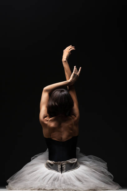 istock Half silhouette modern ballet dancer. Balerina posing on dark background 1470960628
