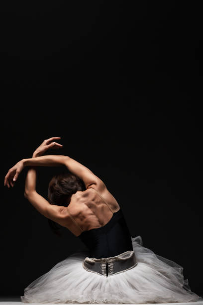 istock Half silhouette modern ballet dancer. Balerina posing on dark background 1470960630