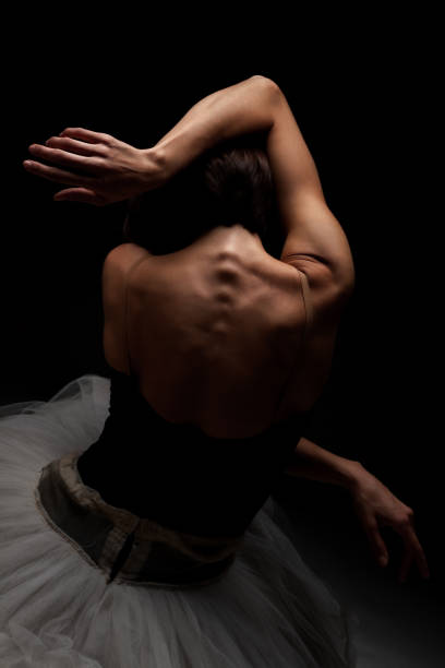 istock Half silhouette modern ballet dancer. Balerina posing on dark background 1470960643