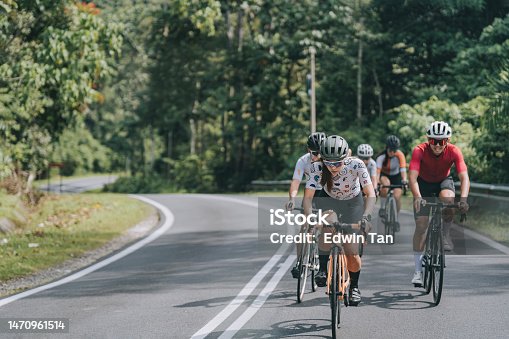 istock asian chinese cyclist cycling competition at rural scene in morning 1470961514