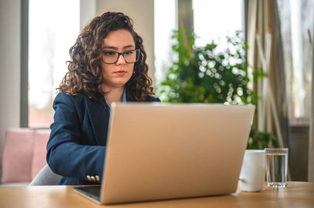 istock Young Caucasian Female Business Strategist Working With A Computer 1470961736