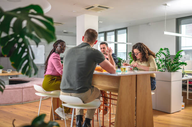istock Multiracial Group of Office Workers Enjoying Sustainable Lunch 1470961910
