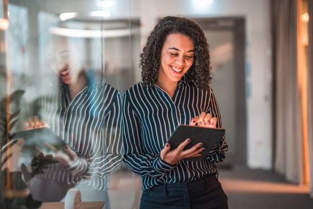 istock Lovely Hispanic Businesswoman Using Digital Tablet In A Modern Office 1470962062