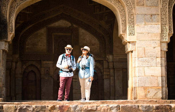 istock Old couple tourist looking up at ancient architecture 1470962421