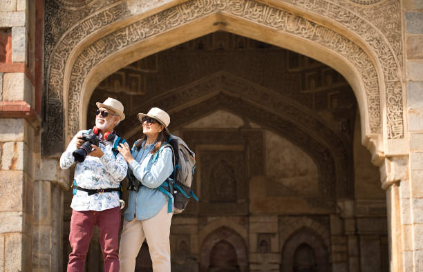 istock Old couple tourist looking up at ancient architecture 1470962482
