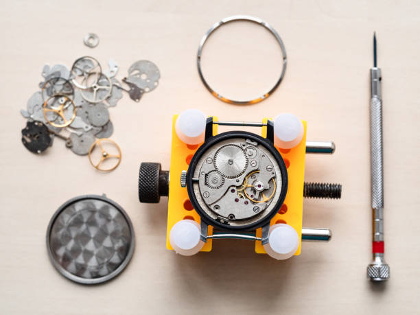 above view of open watch in yellow holder on table stock photo