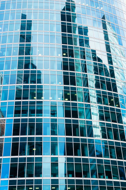 istock glass facade of skyscraper with towers reflection 1470966312