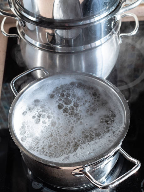 istock water boils in saucepan on ceramic stove at home 1470966350