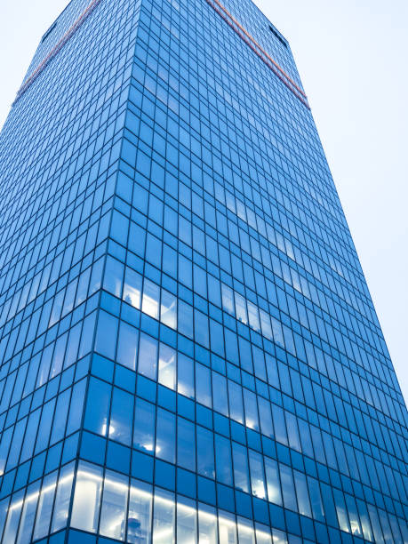 istock glass tower of skyscraper in blue evening twilight 1470966382