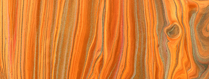 Abstract fluid art background bright orange and golden glitter colors. Liquid marble. Acrylic painting on canvas with ginger gradient. Watercolor backdrop with red wavy pattern. Stone section. Abstract fluid art background dark orange and silver glitter colors. Liquid marble. Acrylic painting on canvas with red gradient. Watercolor backdrop with red wavy pattern. Stone section.