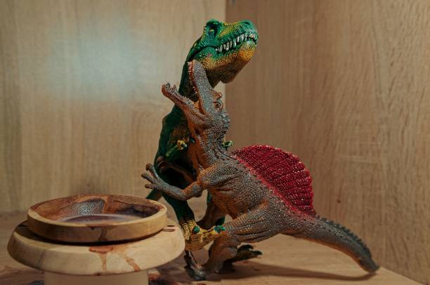 istock Dinosaur toys on a wooden surface, closeup 1470966954