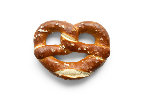 Single salted pretzel on white background