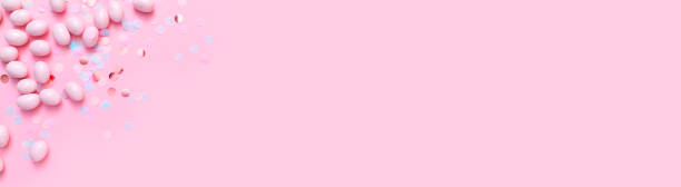 istock Bunch of candy eggs on pink background. Minimal Easter concept with copy space for text. Festive day backdrop. Flat lay style 1470967935