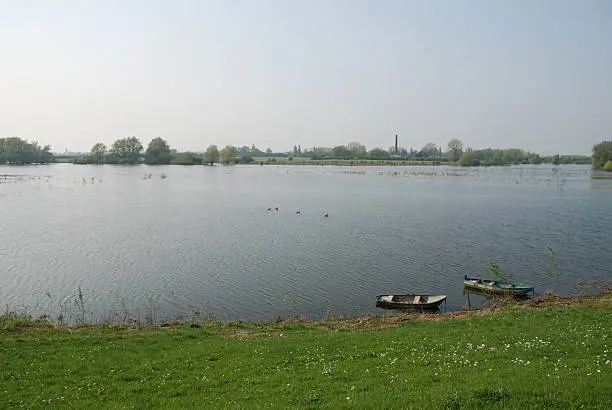 Two rowingboats alone in a lake, in a peaceful setting in spring.