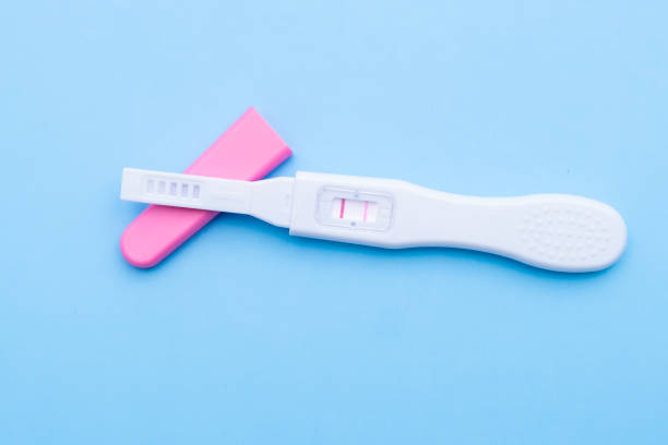 istock Positive pregnancy test on a blue background 1470973206