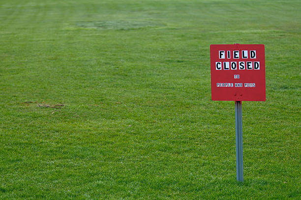 istock Field Closed sign in a grass area 147097334