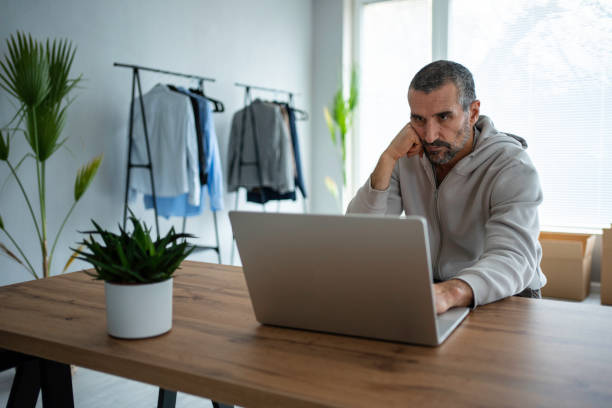 istock E-commerce. Small business owner running online store. 1470973743