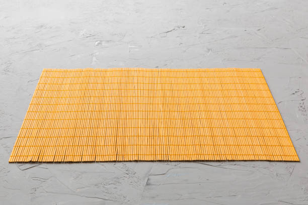 istock Perspective view of yellow tablecloth for food on cement background. Empty space for your design 1470974094